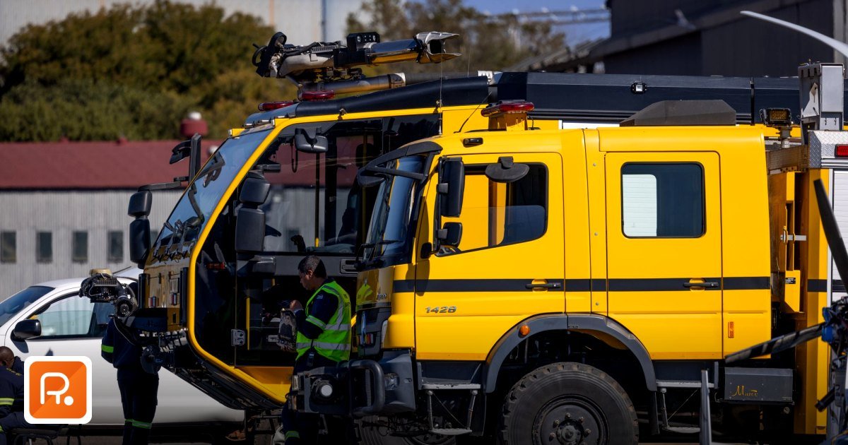 UAE Civil Defence Approved Fire Safety Equipment - yellow fire truck with crew in protective gear at an industrial site